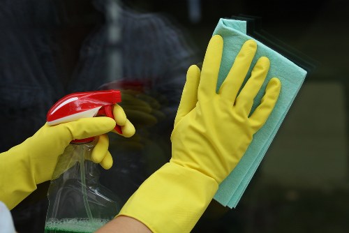 Cleaner preparing carpet cleaning equipment safely